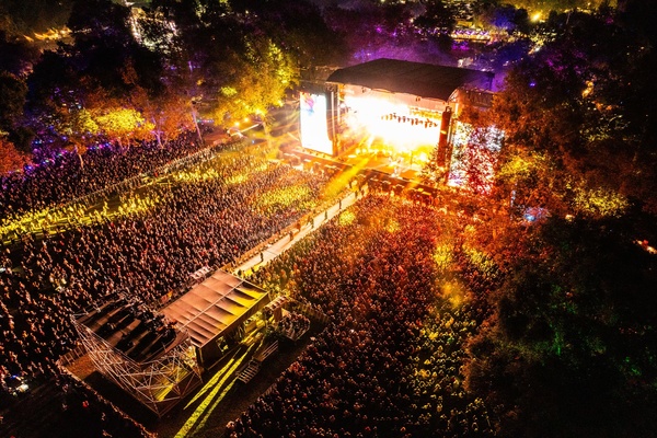 A large crowd of people at a concertDescription automatically generated