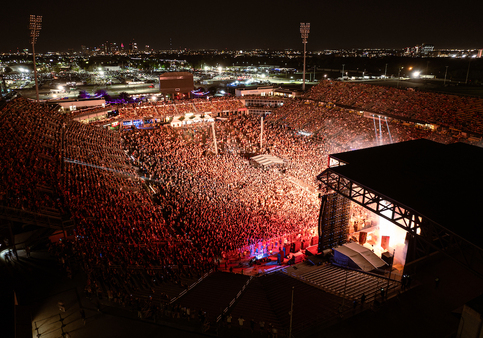 A large crowd of people in a stadiumDescription automatically generated