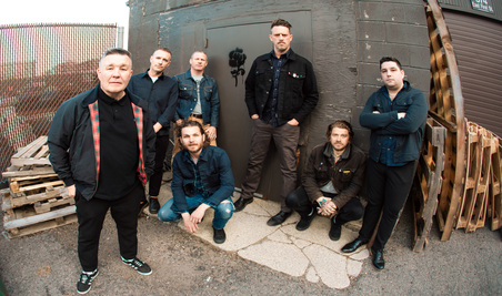 A group of men posing for a photoDescription automatically generated