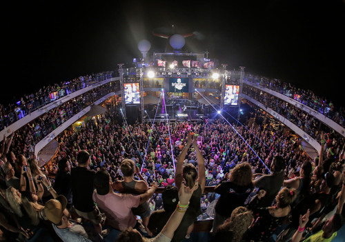 A large crowd of people on a boatDescription automatically generated